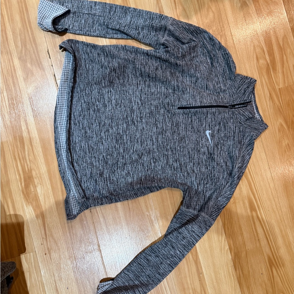 Nike Dri Fit. Only worn a couple times.  Meant for running and working out.